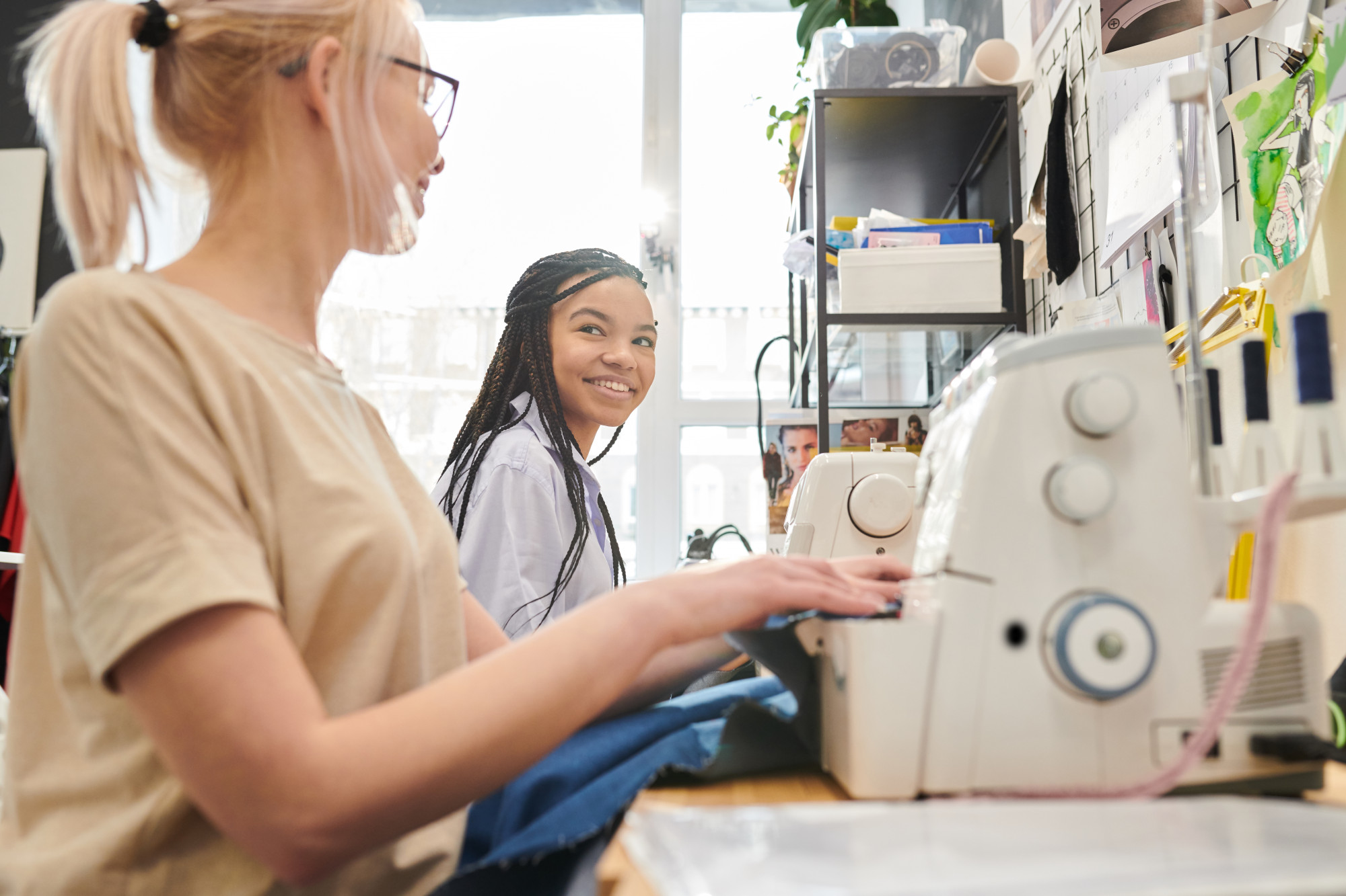 atelier staff operating embroidery machine